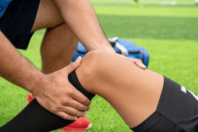 Young sports player receiving hands-on treatment for injury prevention