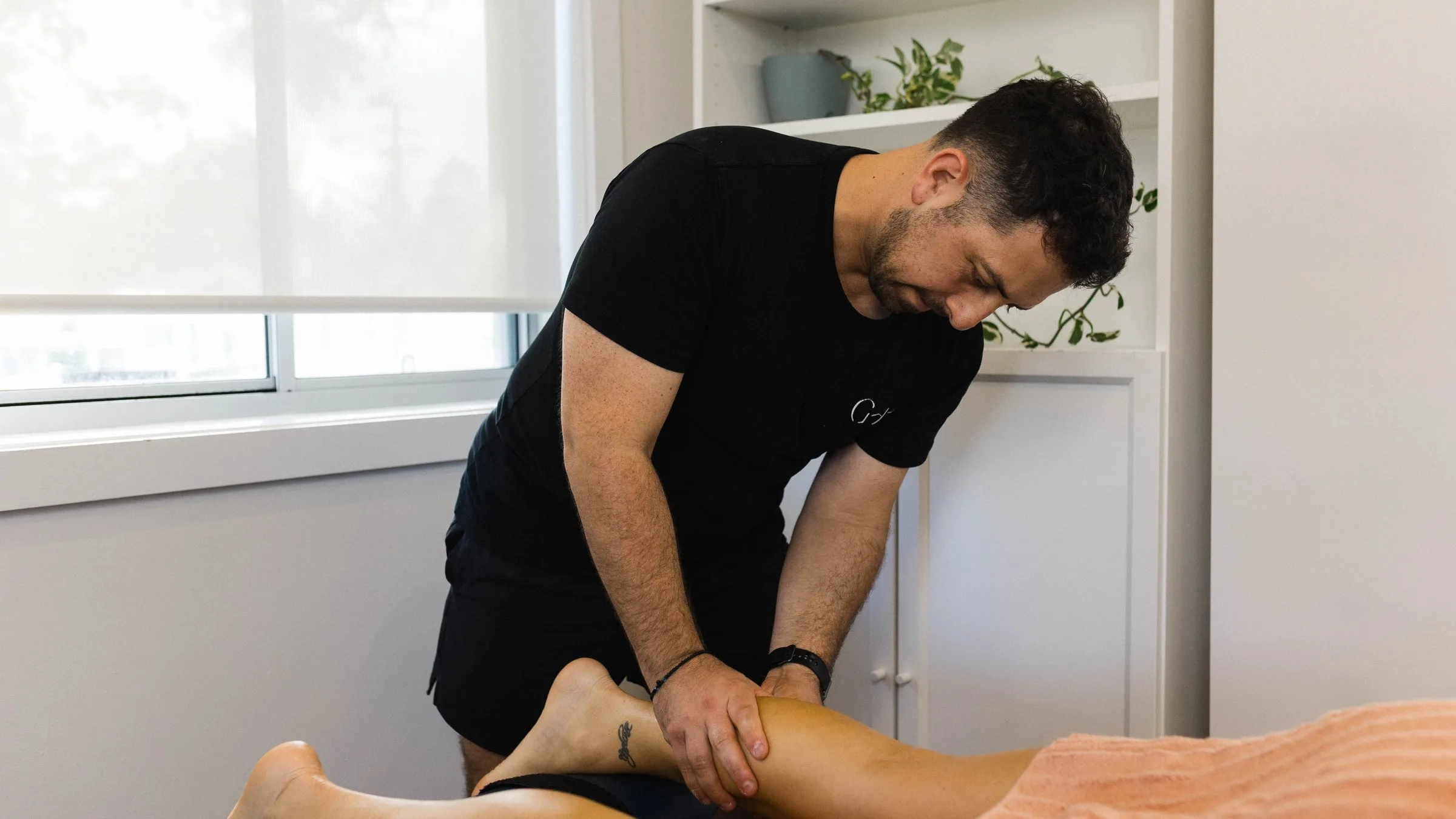 Patient stretching during a rehabilitation session
