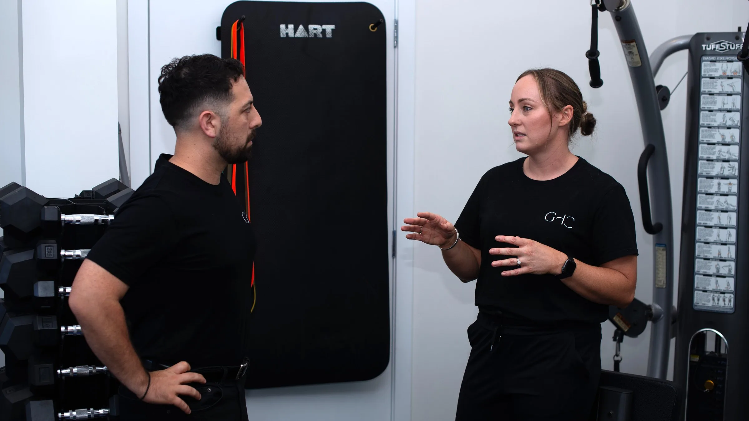 Practitioner massaging a patient’s back in a warm treatment room