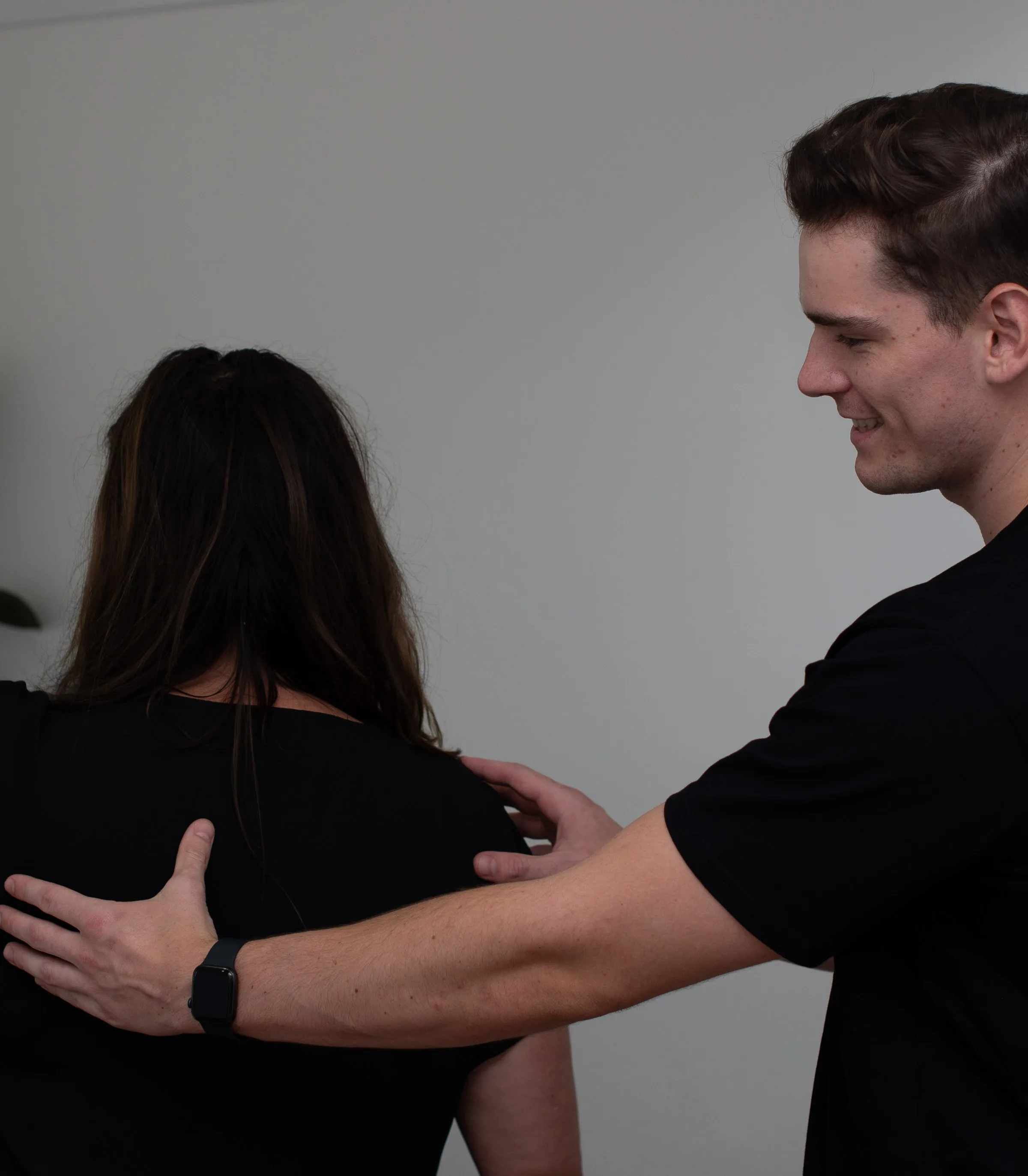 Practitioner treating a patient's neck and shoulder