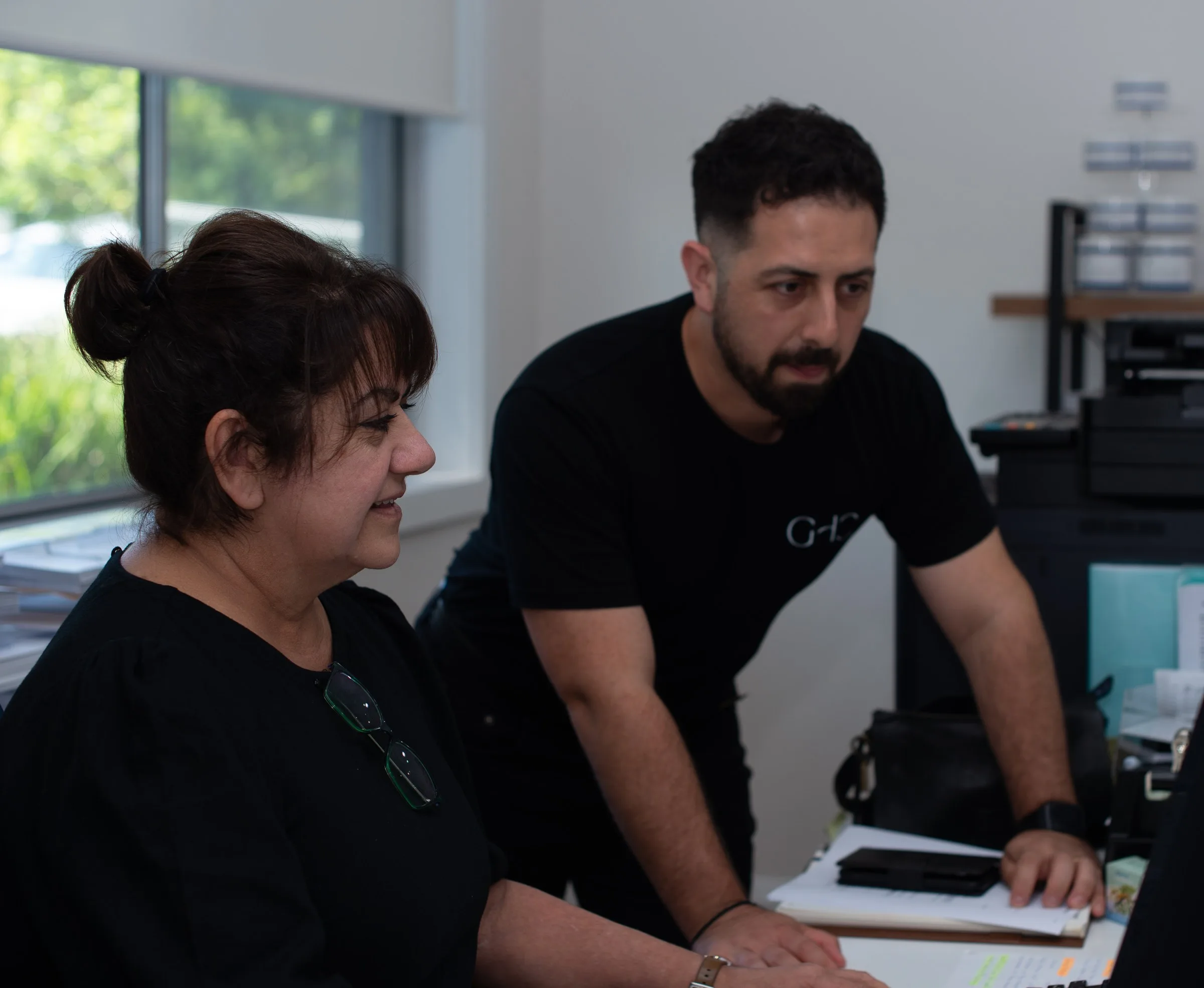 Occupational therapist supporting a client with a daily task