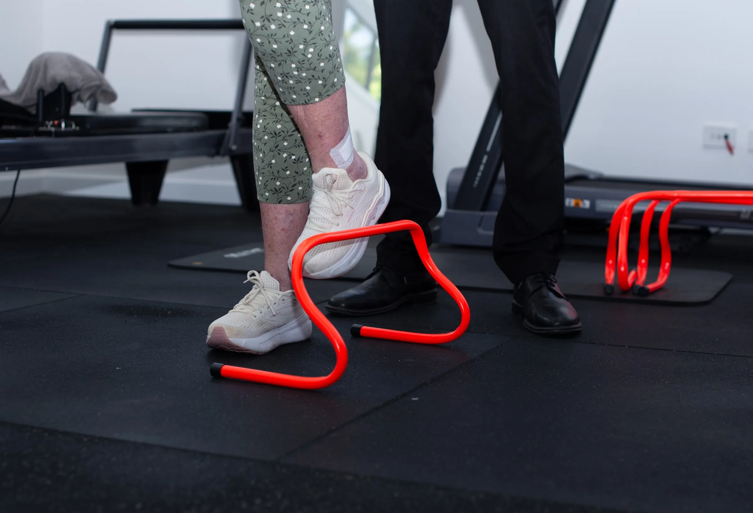Podiatrist assessing a patient's gait