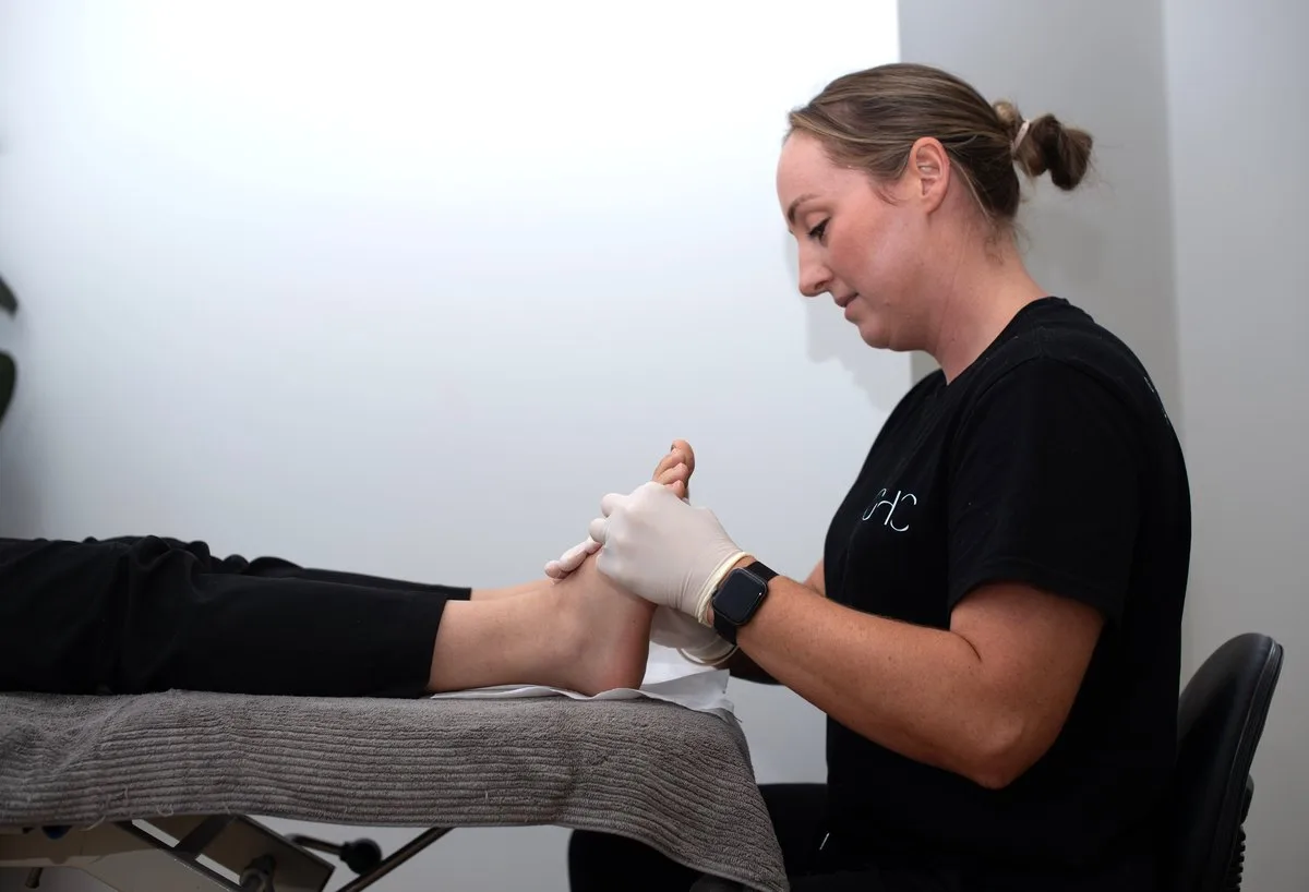 Podiatrist treating a patient's foot
