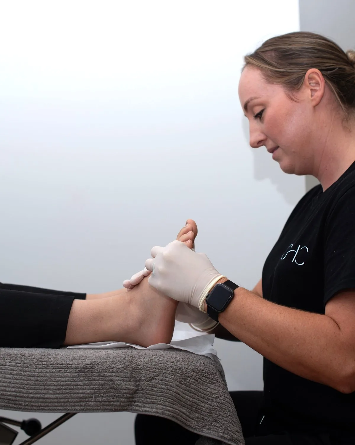 Practitioner guiding a patient through hands-on treatment